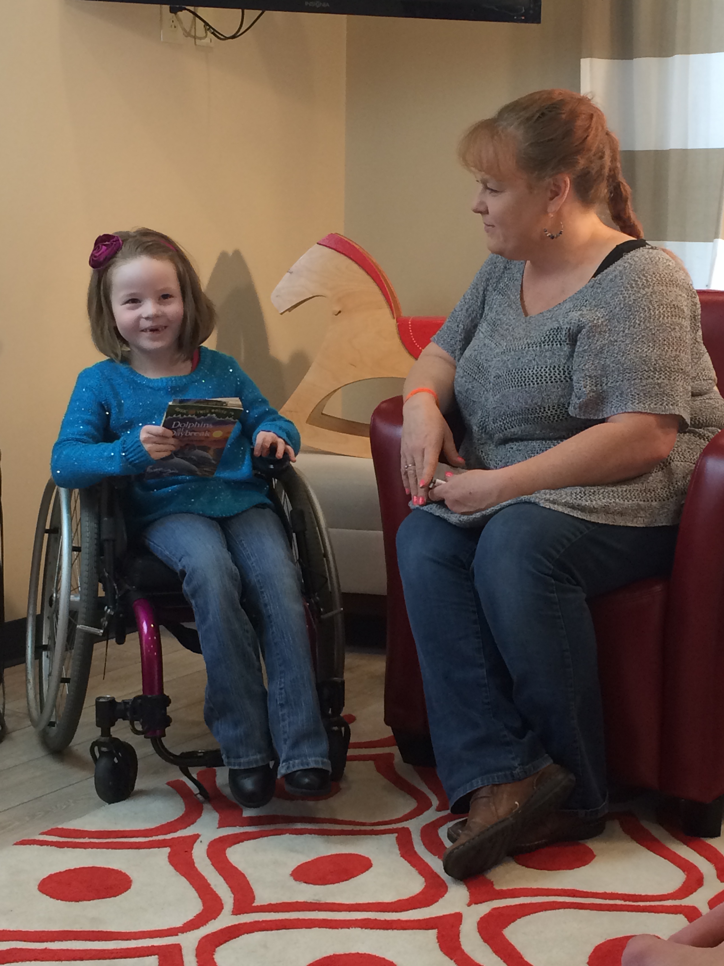 Summer reading to her mom, Angie at the Ronald McDonald House